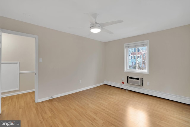 unfurnished room featuring a baseboard heating unit, light hardwood / wood-style flooring, a wall unit AC, and ceiling fan