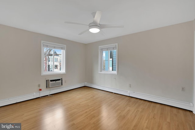 unfurnished room featuring ceiling fan, a wall mounted air conditioner, and light hardwood / wood-style floors