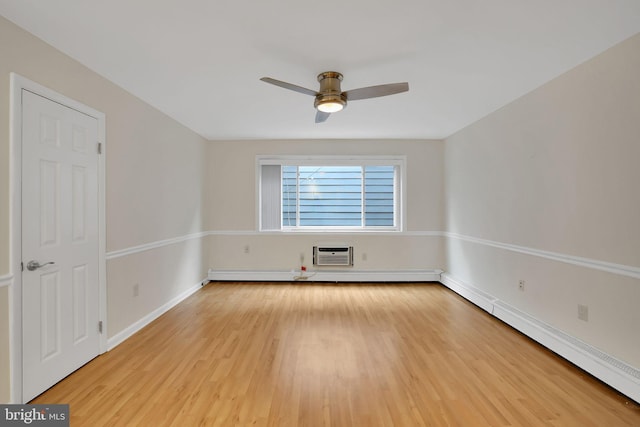 unfurnished room featuring ceiling fan, a baseboard heating unit, a wall mounted AC, and light wood-type flooring