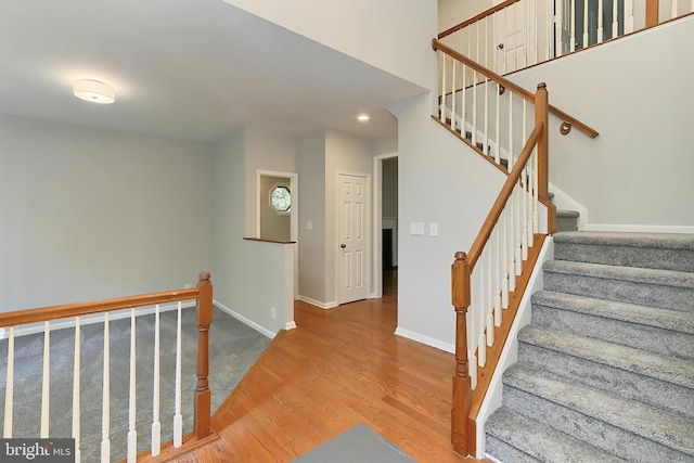 staircase featuring hardwood / wood-style floors