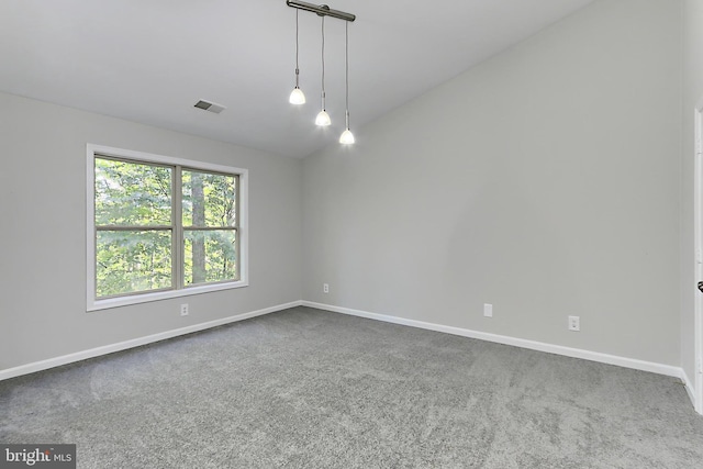 unfurnished room featuring vaulted ceiling and carpet flooring