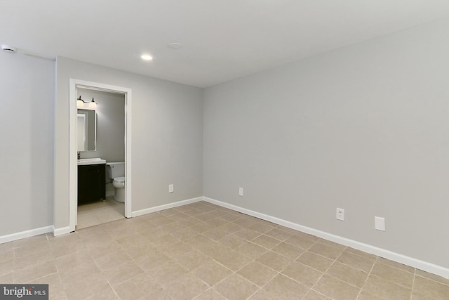 unfurnished bedroom featuring ensuite bath