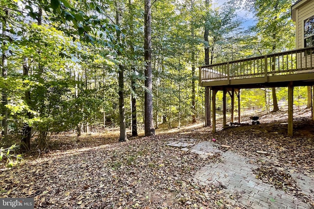 view of yard featuring a wooden deck