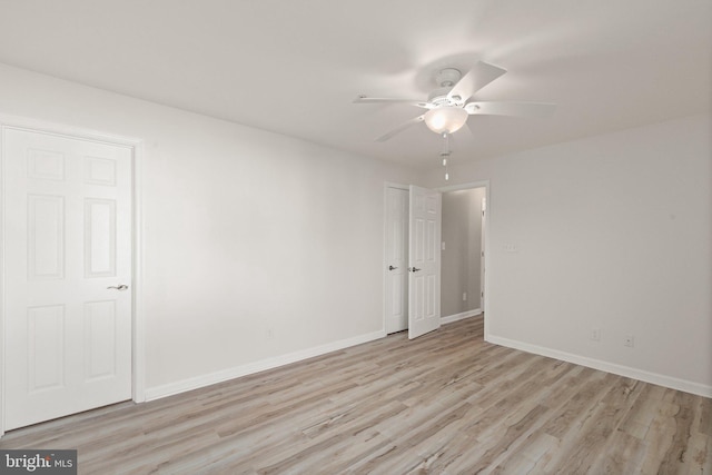 unfurnished room featuring ceiling fan and light hardwood / wood-style flooring