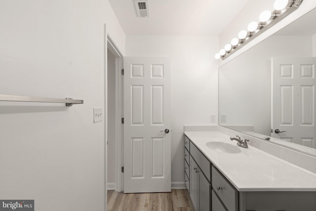 bathroom featuring vanity and wood-type flooring