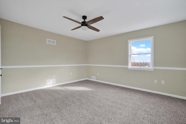 spare room with carpet floors and ceiling fan