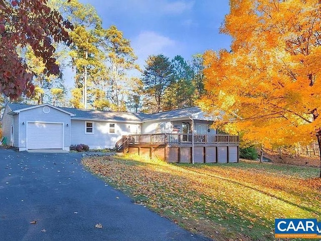 view of front facade featuring a garage and a deck