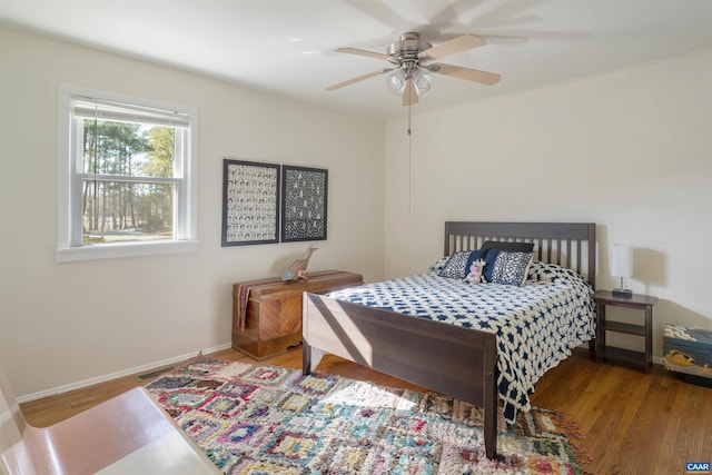 bedroom featuring hardwood / wood-style flooring and ceiling fan