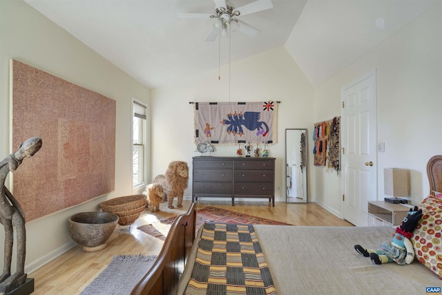 bedroom with vaulted ceiling, ceiling fan, and light hardwood / wood-style floors