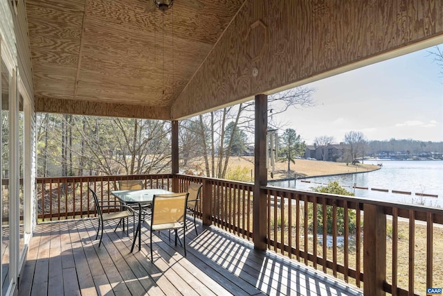 wooden deck featuring a water view