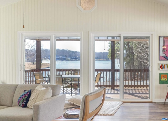 sunroom featuring a water view and plenty of natural light