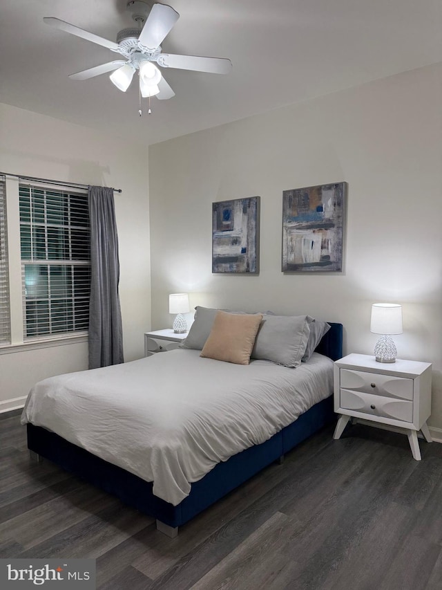 bedroom featuring dark hardwood / wood-style floors and ceiling fan