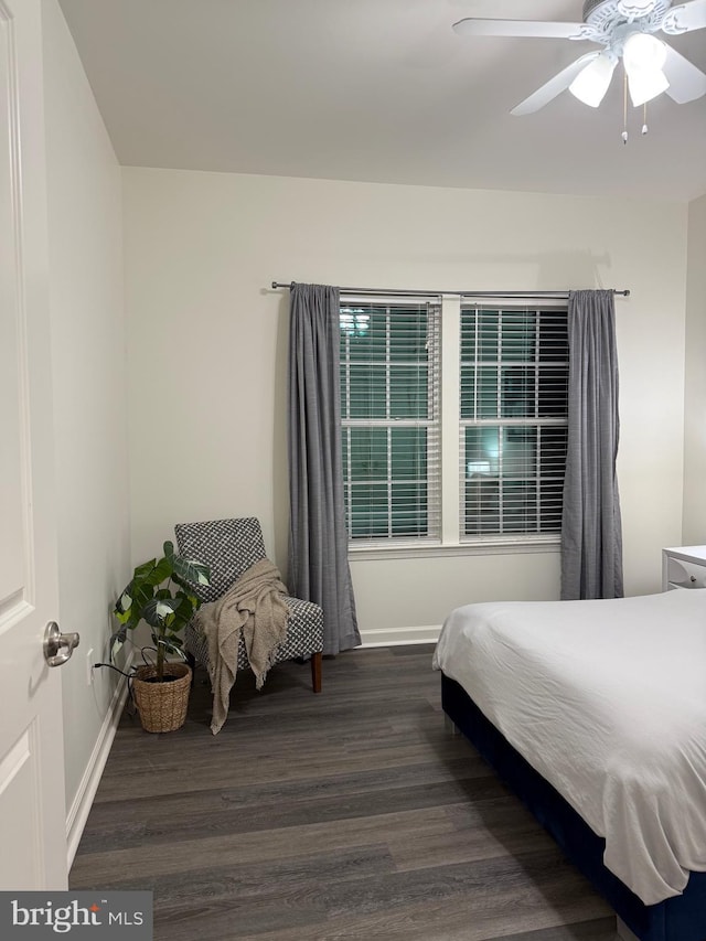 bedroom featuring dark wood-type flooring and ceiling fan