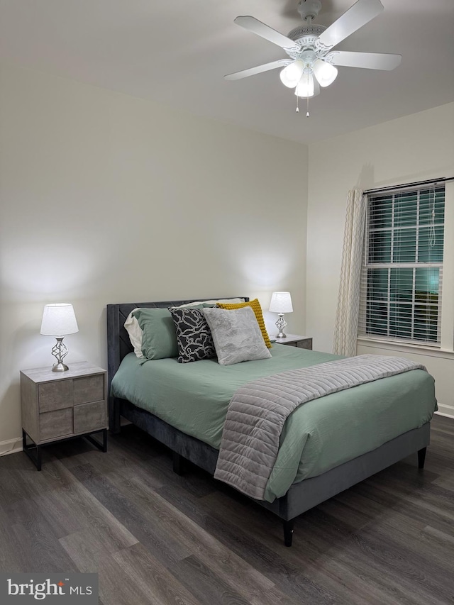 bedroom with dark wood-type flooring and ceiling fan