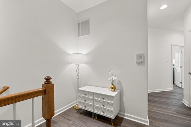 hallway featuring dark wood-type flooring