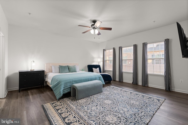 bedroom with dark wood-type flooring and ceiling fan