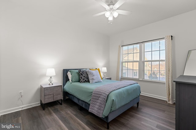 bedroom with dark wood-type flooring and ceiling fan