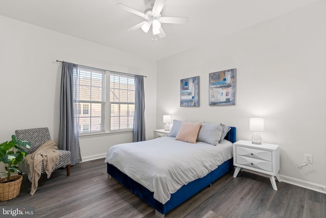 bedroom with dark hardwood / wood-style floors and ceiling fan