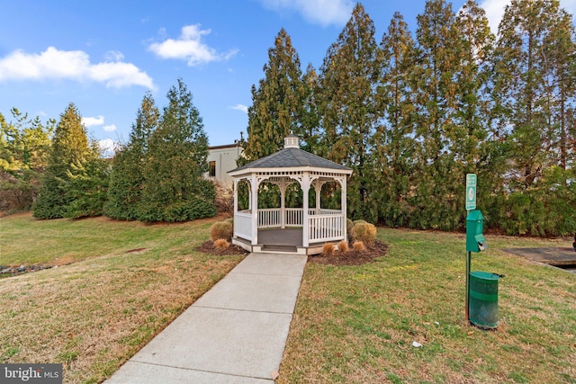 surrounding community with a gazebo and a yard