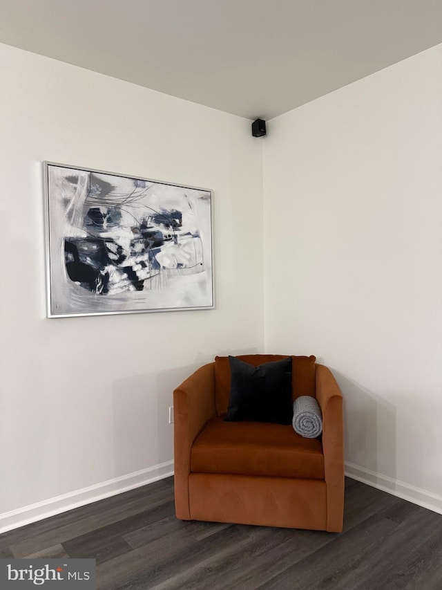 sitting room featuring dark hardwood / wood-style flooring