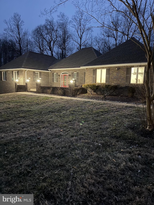 ranch-style home with a front yard