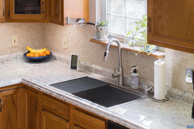 kitchen featuring sink and decorative backsplash