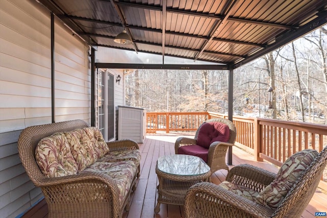 snow covered deck with an outdoor living space