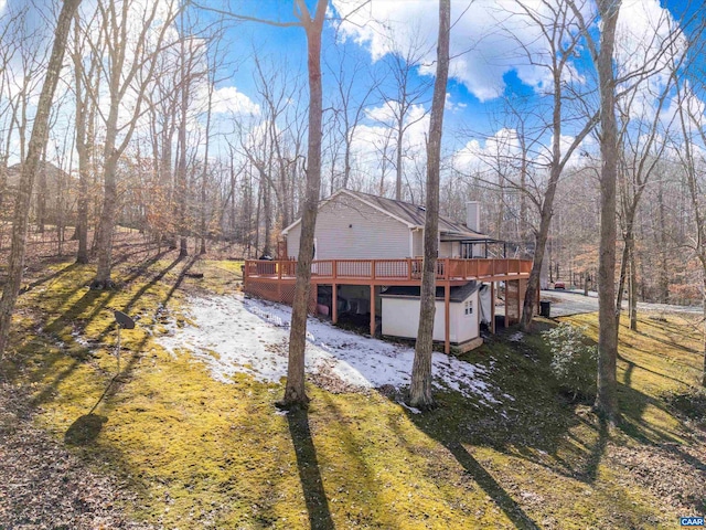 exterior space featuring a wooden deck and a yard