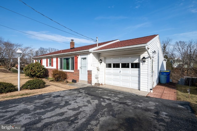 ranch-style home featuring a garage