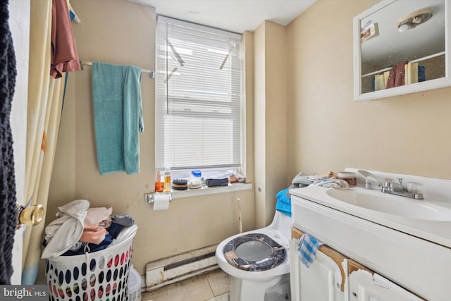 bathroom featuring vanity, a baseboard heating unit, and tile patterned floors