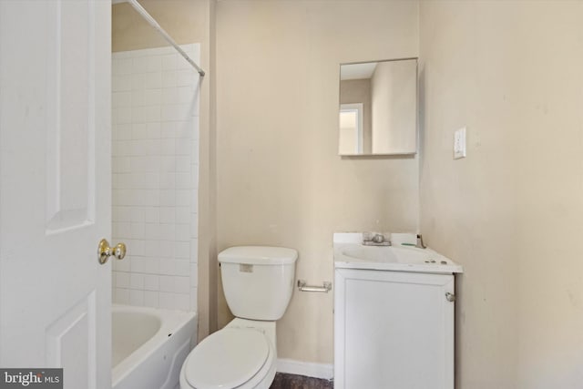 full bathroom with vanity, tiled shower / bath combo, and toilet