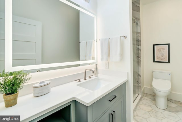 bathroom with vanity, toilet, and a shower with door