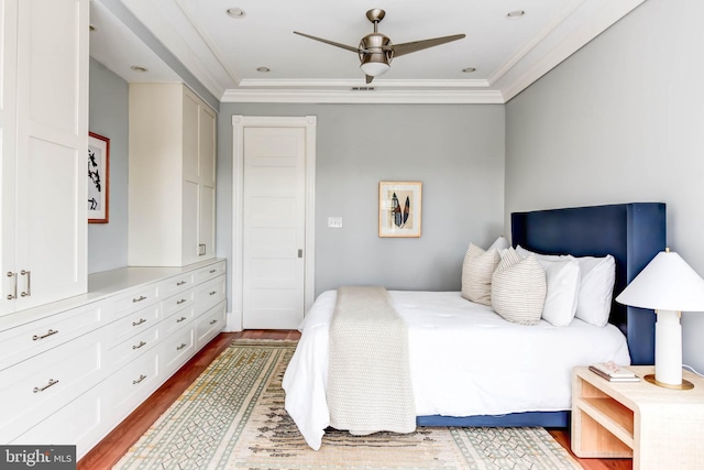 bedroom featuring hardwood / wood-style flooring and ornamental molding