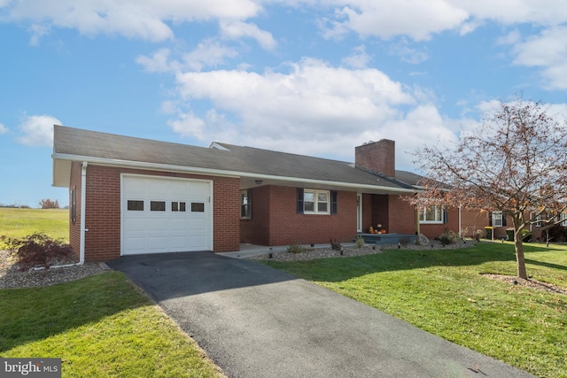 single story home featuring a garage and a front lawn