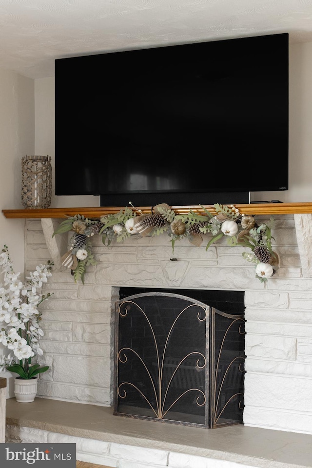 room details featuring a stone fireplace