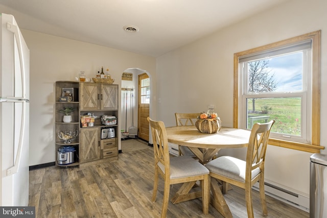 dining area featuring dark hardwood / wood-style floors