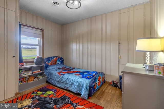 bedroom with light hardwood / wood-style floors