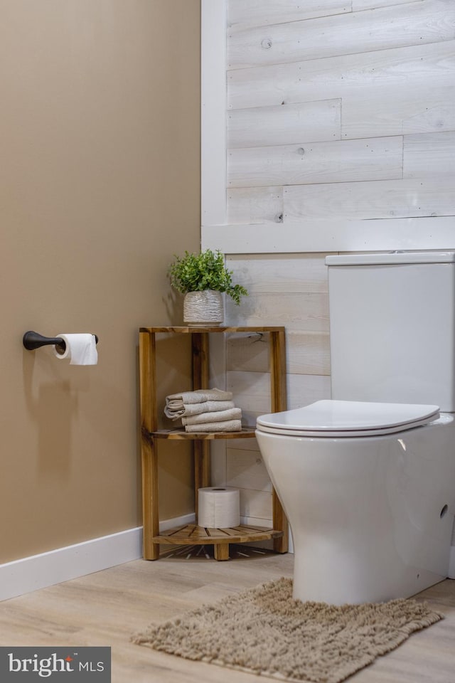 bathroom with wood-type flooring and toilet