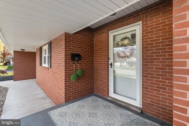 doorway to property with a porch