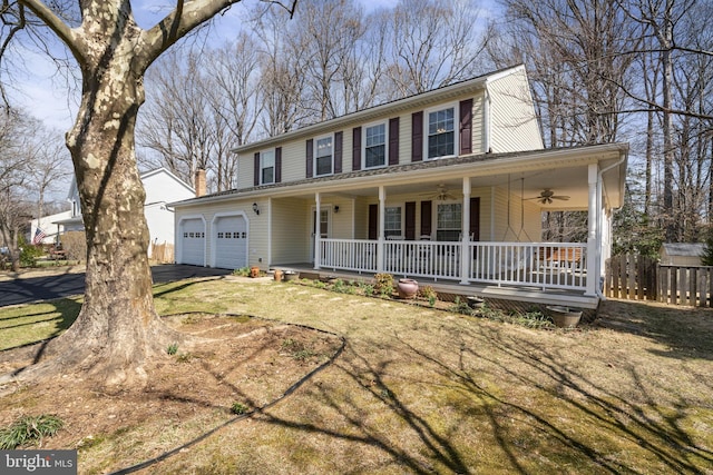 view of front facade featuring fence, driveway, a porch, ceiling fan, and a garage