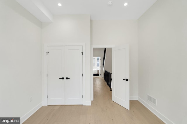 interior space with light hardwood / wood-style floors and a closet