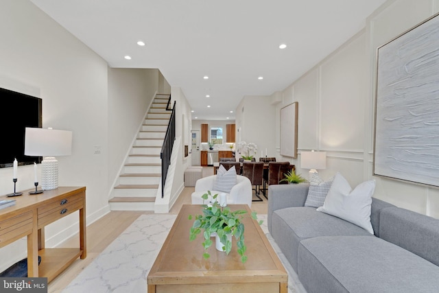 living room with light hardwood / wood-style floors