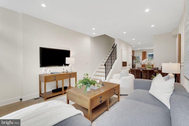 living room with light hardwood / wood-style floors