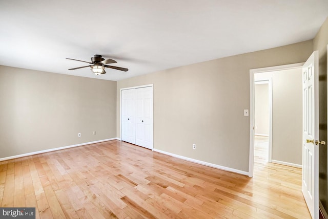 spare room featuring ceiling fan and light wood-type flooring