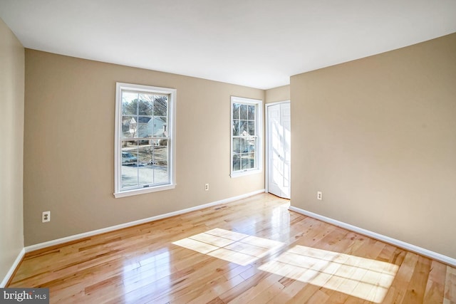 unfurnished room featuring light wood-type flooring