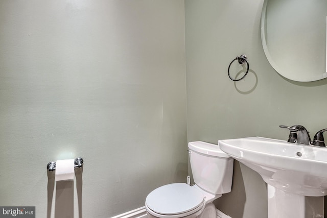 bathroom with toilet and sink