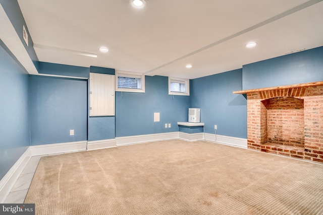 finished basement with recessed lighting, carpet flooring, and baseboards