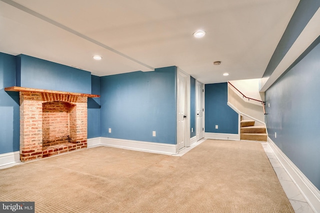 basement featuring carpet floors and a fireplace