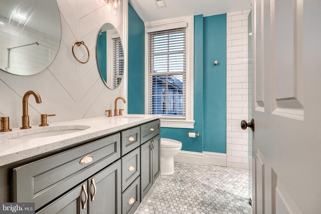 bathroom with vanity, toilet, and tile patterned flooring