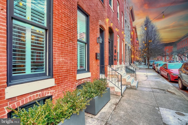 view of side of home featuring brick siding